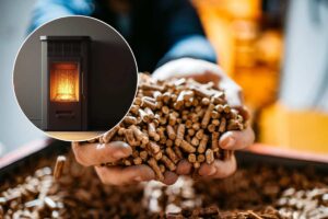 mani con pellet e stufa accesa in un cerchio